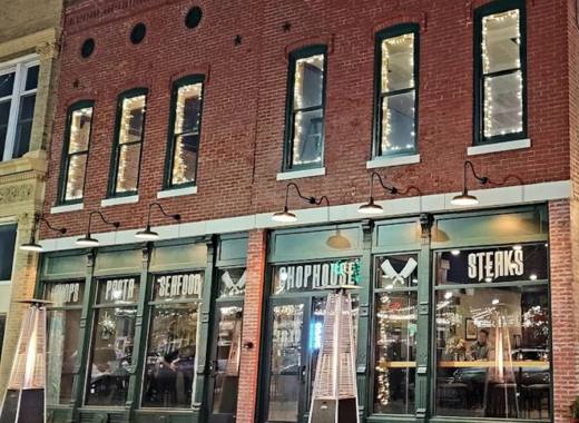 The 1830 Chophouse storefront in the evening