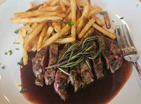 Sliced sirloin served over hand-cut frites
