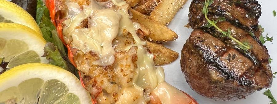 A filet paired with a lobster tail prepared thermidor style